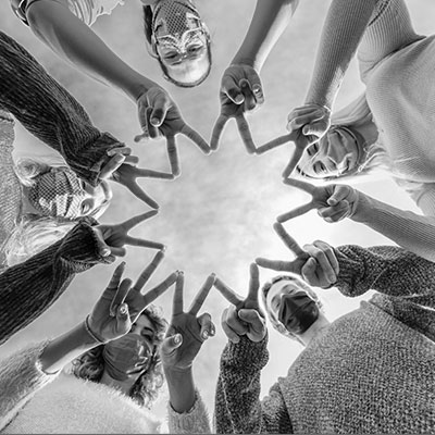 Group of youth giving victory sign